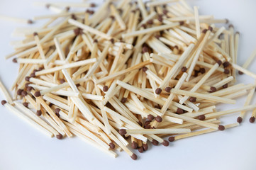 pile of wooden matches in bulk. Focus in the foreground.