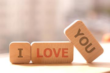 Close-up. Copy space. Concept eco. Wooden cubes with the inscription I love you.