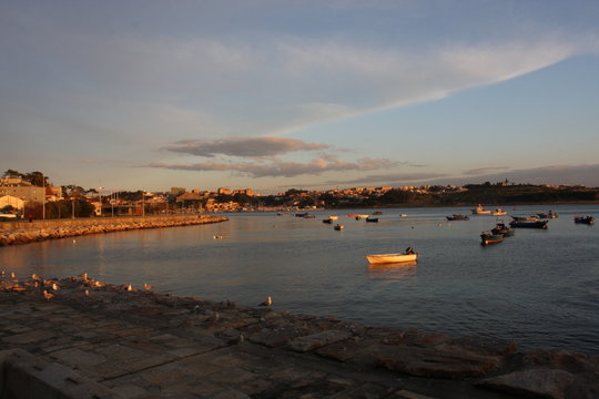 Sunset at the ocean, silhouettes, natural colors