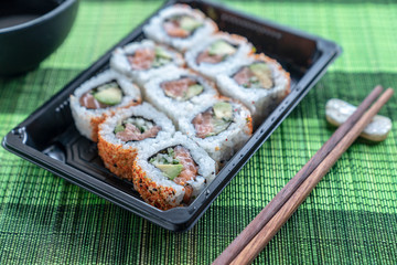 Salmon roll with avocado and spicy, sushi ready to eat