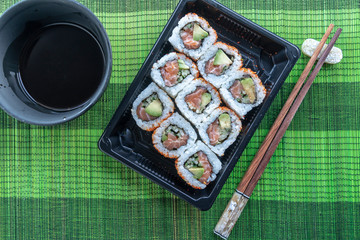 Salmon roll with avocado and spicy, sushi ready to eat