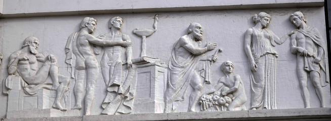 Murals on a building with different scenes