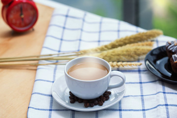 Morning Time. Coffee on the table. coffee beans on table. Smoke on the cup.