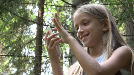 4K Child Playing Smartphone, Little Girl Using Mobile in Mountains Trails Forest