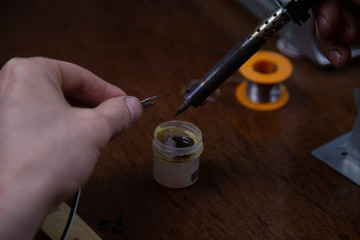 blowtorch, male hands, equipment repair at home