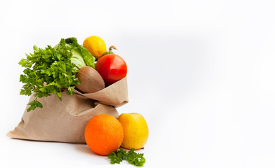 Set of food products on a white background. A paper bag delivers a quarantine food crisis. Food Delivery, Donation, Coronavirus. Fresh vegetables, fruits. Soft focus.