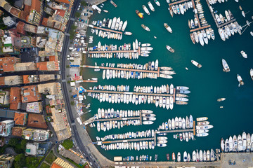 Top view on a harbor with moored sea ships, yachts and sailboats in Ligurian Sea. Santa Margherita Ligure is an italian riviera near Portofino and Genoa.