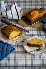 HOT HOME BREAD, ON A TABLE WITH TRADITIONAL TABLECLOTH