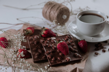 . Chocolate with hazelnuts. Hot drink. Food concept. Food set. Coffee beans. Tasty breakfast. Strawberries with chocolate.