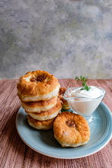 A stack of white Meat pies on a gray plate. Traditional Muslim dish. Arafat, Eid Al Adha.Place for text. Vertical.