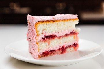 Strawberry yoghurt cake on a white plate
