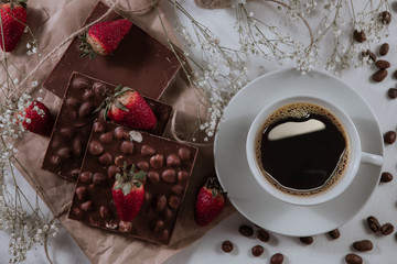 . Chocolate with hazelnuts. Hot drink. Food concept. Food set. Coffee beans. Tasty breakfast. Strawberries with chocolate.