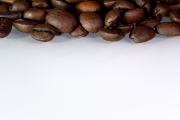 roasted coffee beans background with shadows