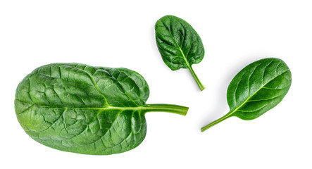 Spinach. Creative layout made of  Spinach leaves   isolated on white background.  Top view. Flat lay.