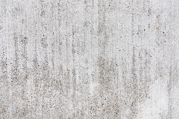 Fresh bread, tomato, garlic, knife on a cutting board. Dark blue background. Side view. Closeup