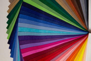 multicolored felt close up laid out by colors in expanded form	