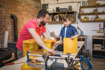 Father and Son Making a Birdhouse