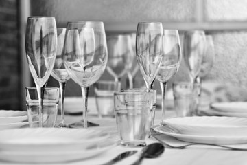 Table settings with diverse glassware and tableware closeup