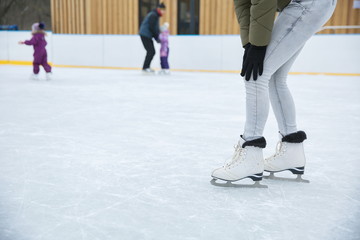 girl on skates holding hands on a sore knee