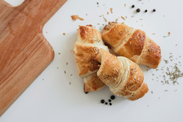 Homemade puff on the white table. Croissant with cheese and meat - 345998456