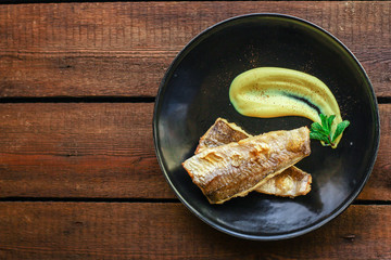 Fried fish fillet hake, seafood main course pescatarian Menu concept. food background. top view copy space for text keto or paleo diet