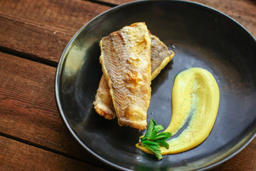 Fried fish fillet hake, seafood main course pescatarian Menu concept. food background. top view copy space for text keto or paleo diet