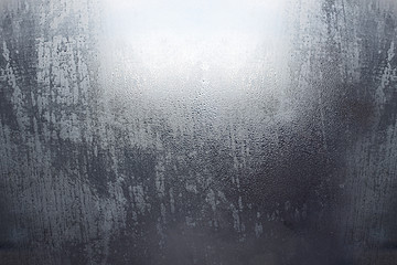 Rain drops on glass. Ecology, climate change, bad weather. Background image.