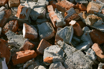 Broken bricks. Destroyed brick wall. Background. concept of destruction, bombing, consequences of military operations.