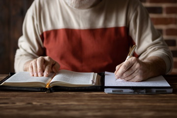 Taking notes and study of the Holy Bible
