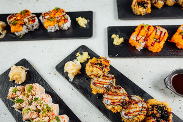 Top view on Set of sushi rolls with ginger soy sauce and Wasabi