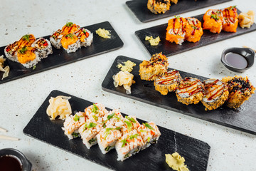 Top view on Set of sushi rolls with ginger soy sauce and Wasabi