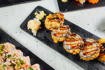 Top view on Set of sushi rolls with ginger soy sauce and Wasabi