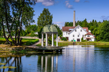 Sightseeing of Estonia. Palmse manor (Palmse möis) museum in Lahemaa National Park. Beautiful summer landscape. A picturesque Park with a pond.