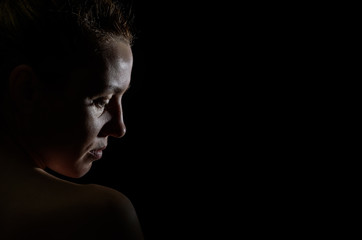 Silhouette portrait of a girl isolated on a dark background	
