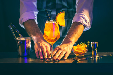 Bartender serving Aperol Spritz cocktail