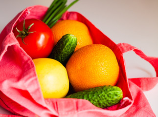 Health food in red eco shopping bag. Healthy eating concept. Vegan and vegetarian concept. Close up.