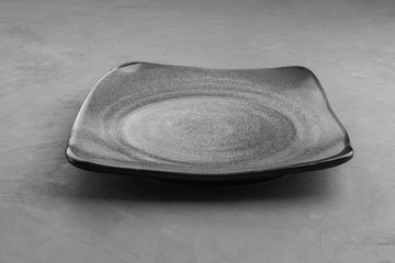 Grey square plate under the concrete for placing products.