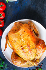 whole baked chicken, fried meat festive table setting Menu concept. food background. top view copy space for text keto or paleo diet