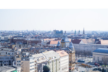 Obraz premium BUDAPEST, HUNGARY - MARCH 2020. Aerial view square with people in front of Saint Stephens Basilica in Budapest