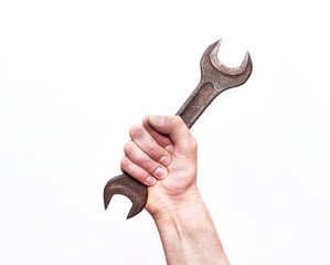 Wrench in hand on a white isolated background. Close up. The concept of repair.