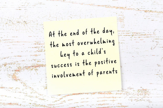 Wise quote on sticky note on wooden wall 