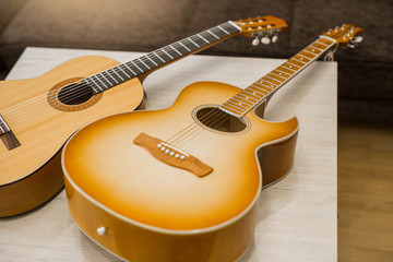 Fototapeta premium two beautiful wooden acoustic guitars 