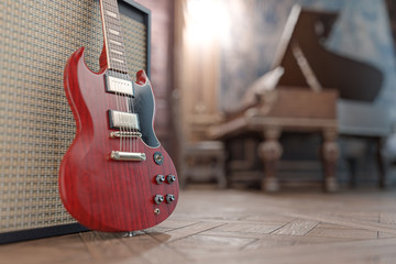 Red electric guitar in a beautiful old room