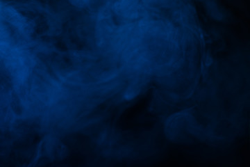 Fototapeta na wymiar Blue steam on a black background.