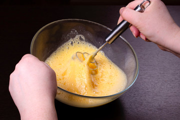 Making of mixing eggs in bowl