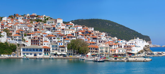 Fototapeta na wymiar Beautiful panoramic summer view of old town and harbor of Skopelos Island, Northern Sporades islands, Greece