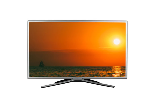 4K monitor or TV isolated on white background with a summer seascape with a sailboat at sunset