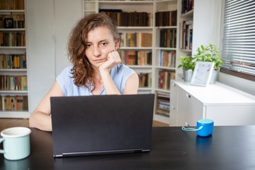 Fototapeta na wymiar happy woman working on laptop in home office