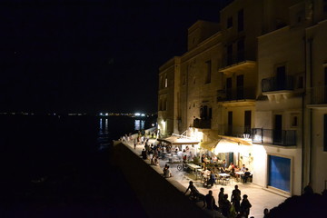 Night seaside bars, Monopoli, Puglia, Italy