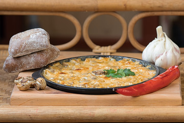Mushrooms baked in sour cream and cheese with garlic and pepper
